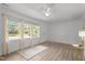 Inviting living area boasting hardwood floors, natural light from large windows, and a ceiling fan at 1832 Blandwood Dr, Rocky Mount, NC 27801