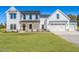 Beautiful new construction featuring a three-car garage, charming porch, and board and batten siding at 193 Jim S Rd, Cameron, NC 28326