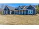 New construction home boasts a stylish gray exterior, inviting porch, and ample natural light at 193 Jim S Rd, Cameron, NC 28326