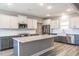 Spacious kitchen features white cabinets, an island, granite countertops, and stainless steel appliances at 193 Jim S Rd, Cameron, NC 28326