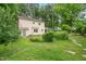 A spacious backyard with lush greenery and a garden area, perfect for outdoor activities at 20 Timberlyne Rd, Chapel Hill, NC 27514
