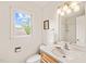 Well-lit bathroom with wood-look vanity, framed mirror, and walk-in shower at 20 Timberlyne Rd, Chapel Hill, NC 27514