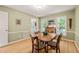 Traditional dining room boasting hardwood floors, a wooden table, and abundant natural light at 20 Timberlyne Rd, Chapel Hill, NC 27514