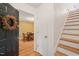 Inviting entryway with hardwood floors, stairs, and a view of the dining room at 20 Timberlyne Rd, Chapel Hill, NC 27514