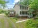 Charming two-story home with a welcoming front porch and beautiful green shutters at 20 Timberlyne Rd, Chapel Hill, NC 27514