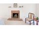 Bedroom fireplace with brick hearth, white mantle, and decorative accents at 20 Timberlyne Rd, Chapel Hill, NC 27514