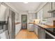 Functional kitchen with stainless steel appliances, butcher block counters, and ample cabinet space at 20 Timberlyne Rd, Chapel Hill, NC 27514
