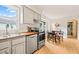 Eat-in kitchen featuring stainless steel appliances, butcher block countertops, and bright natural light at 20 Timberlyne Rd, Chapel Hill, NC 27514