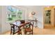 Kitchen with dining table and plenty of natural light from the large windows at 20 Timberlyne Rd, Chapel Hill, NC 27514