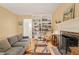 Cozy living room with hardwood floors, fireplace, built in bookshelves, and comfortable seating at 20 Timberlyne Rd, Chapel Hill, NC 27514