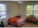 Inviting bedroom with bright light from windows at 2000 University Woods Rd # 203, Raleigh, NC 27603