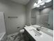 Bathroom featuring a single sink, granite countertops, and a tub at 202 S Pearl St, Princeton, NC 27569