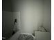 Unfinished bathroom with a toilet, shower, and tile floors at 202 S Pearl St, Princeton, NC 27569