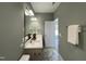Bathroom featuring a vanity, mirror, and herringbone floors at 202 S Pearl St, Princeton, NC 27569