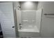 Bathroom featuring a white shower and grey walls at 202 S Pearl St, Princeton, NC 27569