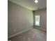 Cozy bedroom offers a serene retreat with natural light streaming through the window at 202 S Pearl St, Princeton, NC 27569