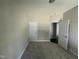 This bedroom features neutral walls, carpet flooring, two doors and a white trim at 202 S Pearl St, Princeton, NC 27569