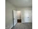 Bedroom featuring carpet, off-white walls, and a closet at 202 S Pearl St, Princeton, NC 27569
