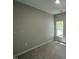 Bedroom featuring carpet, off-white walls, and a window at 202 S Pearl St, Princeton, NC 27569