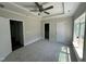 Bright bedroom offering great lighting with a ceiling fan and big windows at 202 S Pearl St, Princeton, NC 27569
