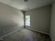 This bedroom features neutral walls, carpet flooring and a window bringing in natural light at 202 S Pearl St, Princeton, NC 27569