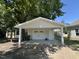 View of detached garage with front and side entry doors at 202 S Pearl St, Princeton, NC 27569