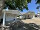 View of detached garages with carports at 202 S Pearl St, Princeton, NC 27569