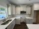 Well-equipped kitchen with ample cabinetry, stainless steel appliances, and stylish subway tile backsplash at 202 S Pearl St, Princeton, NC 27569