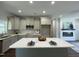 Eat-in kitchen with stainless steel appliances, a kitchen island, and modern countertops at 202 S Pearl St, Princeton, NC 27569