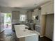 Bright and modern kitchen featuring stainless steel appliances and a stylish island at 202 S Pearl St, Princeton, NC 27569