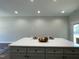 Spacious kitchen island is ready to host meals and features a modern design at 202 S Pearl St, Princeton, NC 27569