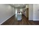Open floor plan features a kitchen island with modern appliances and hardwood floors at 202 S Pearl St, Princeton, NC 27569