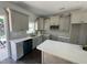 Well-lit kitchen features granite countertops, stainless steel appliances, and ample cabinet space at 202 S Pearl St, Princeton, NC 27569