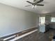 Spacious living room with hardwood floors, ceiling fan, and a bright, airy feel at 202 S Pearl St, Princeton, NC 27569