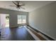 Hardwood floors and lots of natural light make this living room a great place to relax at 202 S Pearl St, Princeton, NC 27569