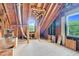 Large unfinished attic provides potential for expansion with natural light and exposed framework at 209 Bradley Dr, Benson, NC 27504