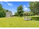 Large backyard features a gazebo and plenty of green space at 209 Bradley Dr, Benson, NC 27504