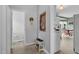 Hallway leading to an eat-in kitchen featuring a view of the breakfast nook and appliances at 209 Bradley Dr, Benson, NC 27504