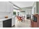 Eat-in kitchen features a breakfast nook with dining table and large windows for ample sunlight at 209 Bradley Dr, Benson, NC 27504