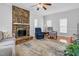 Spacious living room with stone fireplace and large rug at 209 Bradley Dr, Benson, NC 27504