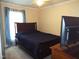 Comfortable bedroom with a queen bed, natural light, and a TV on a dresser at 220 Howard St, Burlington, NC 27217