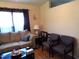 Bright living room with a comfortable sofa, a large window, and cozy decor at 220 Howard St, Burlington, NC 27217
