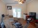 Inviting living room featuring hardwood floors, comfortable seating, and lots of natural light at 220 Howard St, Burlington, NC 27217