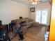 Cozy living room with comfortable seating, hardwood floors, and access to outdoor space at 220 Howard St, Burlington, NC 27217