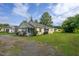 Beautiful one-story home with lovely flowers, large yard and covered porch at 306 W Main St, Pine Level, NC 27568