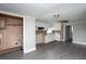 The kitchen features white cabinets and stainless steel appliances plus vinyl flooring at 306 W Main St, Pine Level, NC 27568