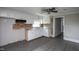 Spacious kitchen with white cabinets, updated flooring and a stainless steel sink at 306 W Main St, Pine Level, NC 27568