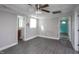 Open floor plan showcases light-filled living room with doors and wood-look flooring at 306 W Main St, Pine Level, NC 27568