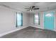 Inviting living room featuring updated flooring and a vibrant turquoise front door at 306 W Main St, Pine Level, NC 27568