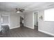 View of a living room featuring wood-look flooring and multiple access points at 306 W Main St, Pine Level, NC 27568